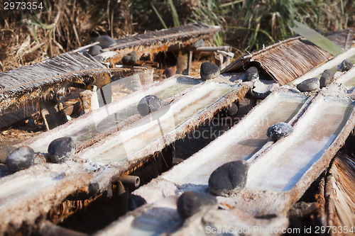 Image of Production common salt in the old way. Indonesia, Bali