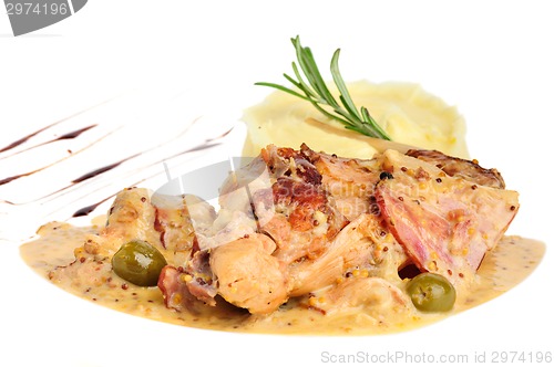 Image of Rabbit legs with potato puree and rosemary