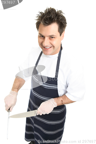 Image of Smiling butcher or chef sharpens knife