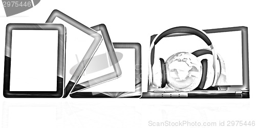 Image of headphones and  earth on the  laptop and tablet pc