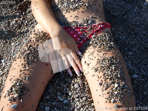Image of The sexual girl in a pebble on a beach3