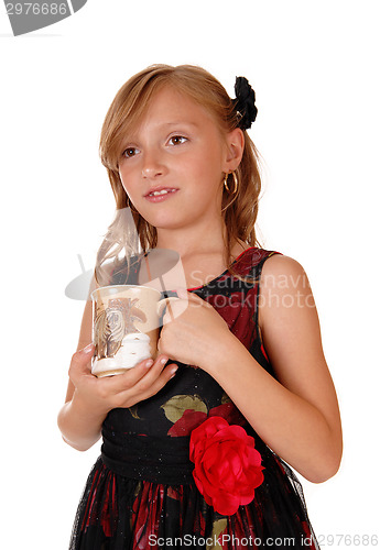 Image of Girl holding a mug.