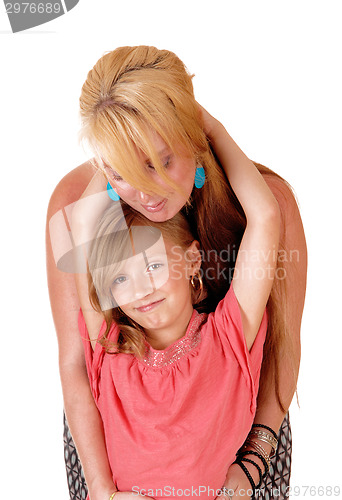 Image of Daughter hugging mom.