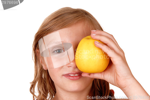 Image of Girl playing with apple.