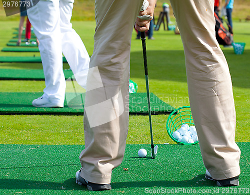 Image of golfer ready to tee off