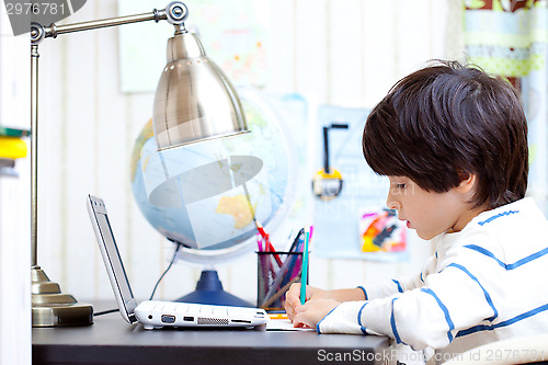 Image of schoolboy doing homework