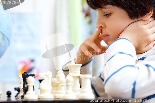 Image of boy playing a game of chess