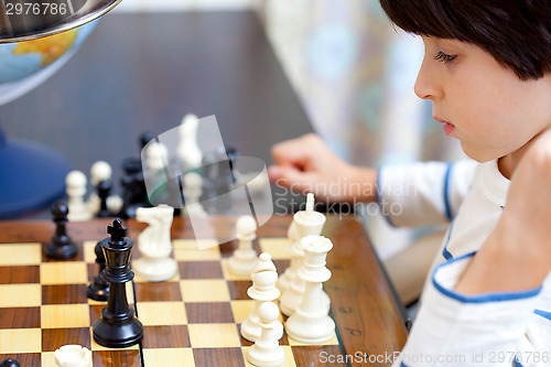 Image of boy and chess