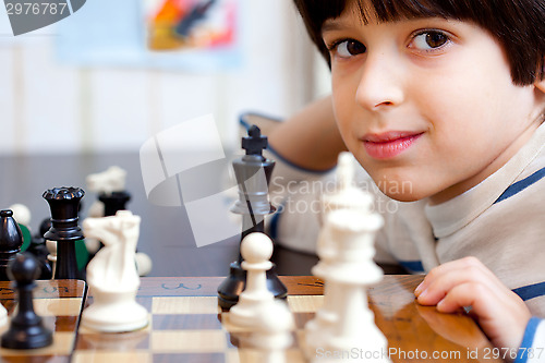 Image of boy and chess, close-up