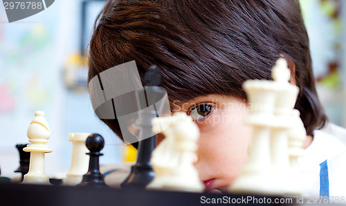 Image of boy and chess