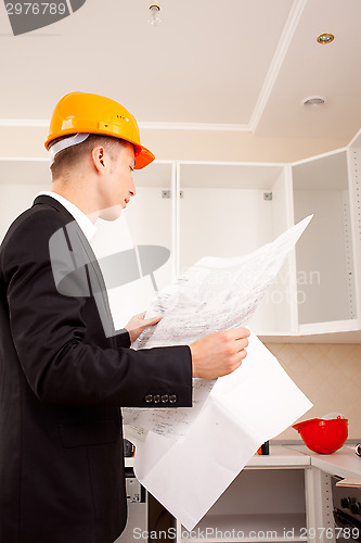 Image of engineer with blueprints