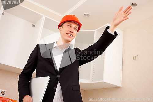 Image of Engineer indicates the direction of hand