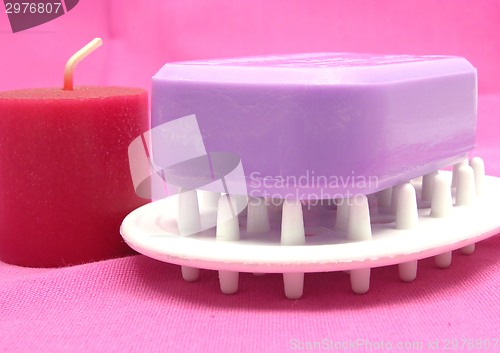 Image of Lilac soap with candlet on a  pink background