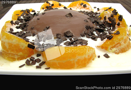 Image of Chocolate pudding with yoghurt, sliced tangerines and chocolate