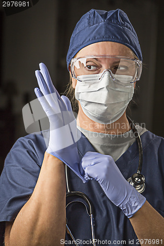 Image of Concerned Female Doctor or Nurse Putting on Protective Facial We