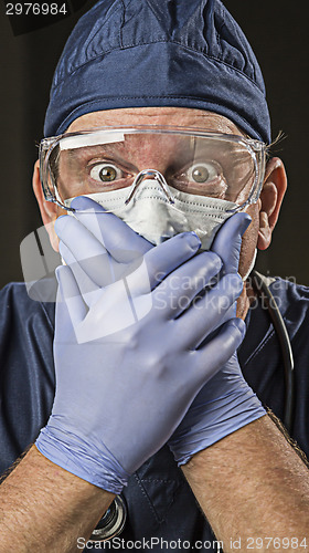 Image of Stunned Doctor or Nurse with Protective Wear and Stethoscope