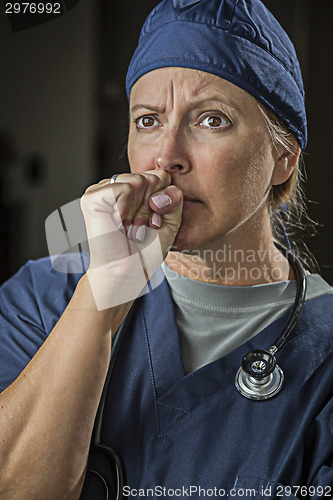 Image of Concerned Looking Female Doctor or Nurse