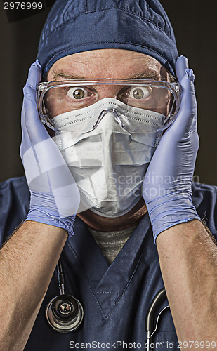 Image of Stunned Doctor or Nurse with Protective Wear and Stethoscope
