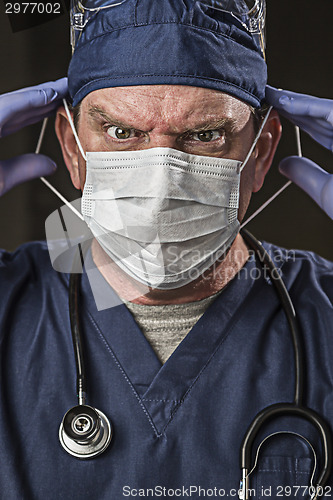 Image of Determined Looking Doctor or Nurse with Protective Wear and Stet