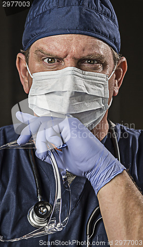 Image of Determined Looking Doctor or Nurse with Protective Wear and Stet