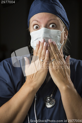 Image of Shocked Female Doctor with Hands in Front of Mouth