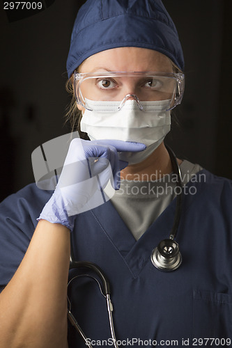 Image of Concerned Female Doctor or Nurse Wearing Protective Facial Wear