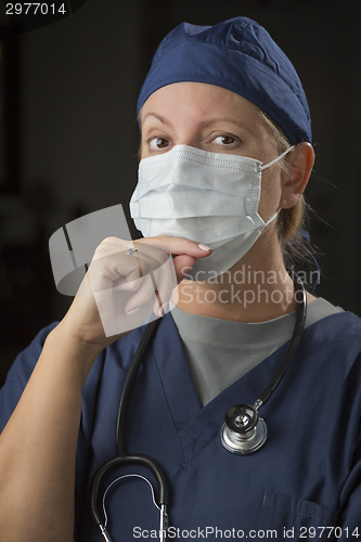 Image of Female Doctor or Nurse Wearing Protective Face Mask 