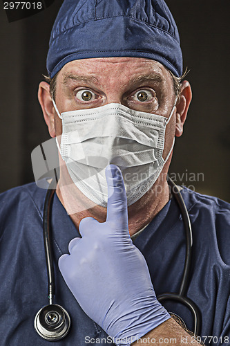 Image of Stunned Doctor or Nurse with Protective Wear and Stethoscope