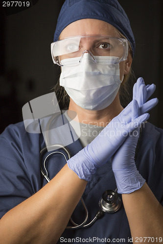 Image of Concerned Female Doctor or Nurse Wearing Protective Facial Wear