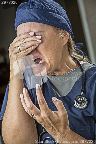 Image of Agonizing Crying Female Doctor or Nurse