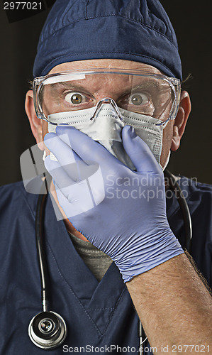 Image of Stunned Doctor or Nurse with Protective Wear and Stethoscope