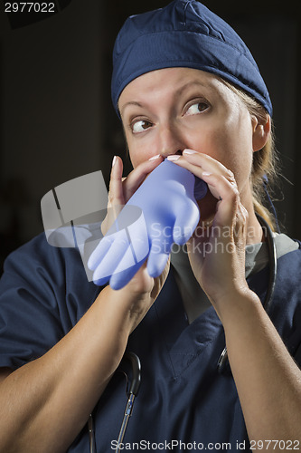 Image of Playful Doctor or Nurse Inflating Surgical Glove