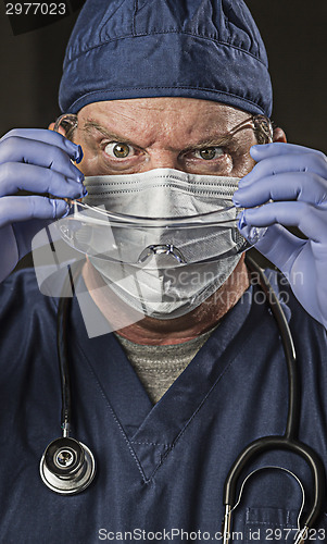 Image of Determined Looking Doctor or Nurse with Protective Wear and Stet