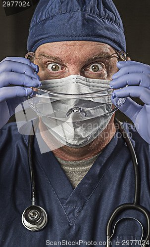 Image of Determined Looking Doctor or Nurse with Protective Wear and Stet