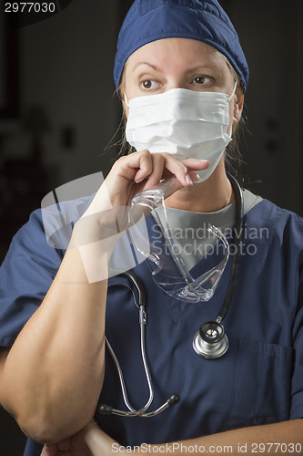 Image of Female Doctor or Nurse Wearing Protective Face Mask 