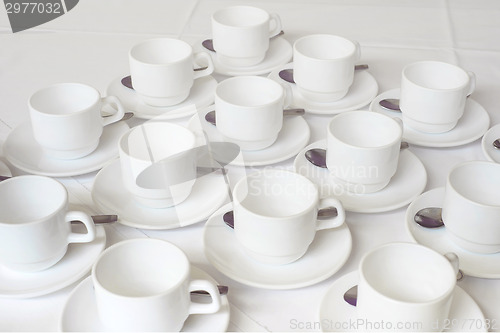 Image of Group of white coffee cups in cafe bar