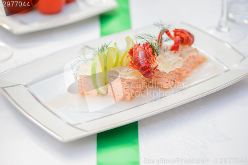 Image of Fish dish and crayfish on the festive table