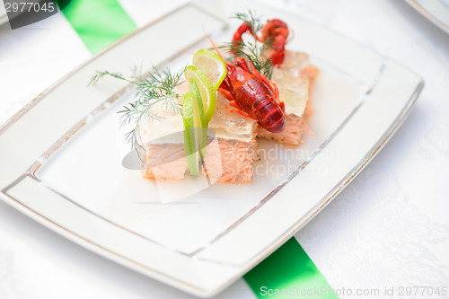 Image of Fish dish and crayfish on the festive table