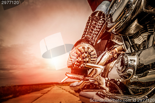 Image of Biker girl riding on a motorcycle