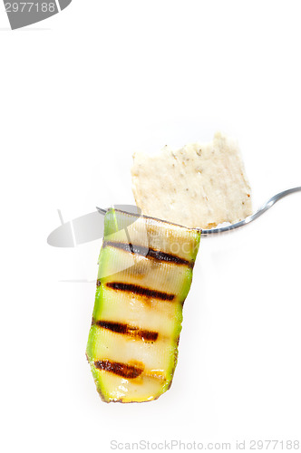Image of grilled zucchini courgette with cracker on a fork