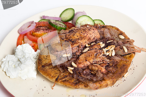 Image of Musakhan with salad and yoghurt