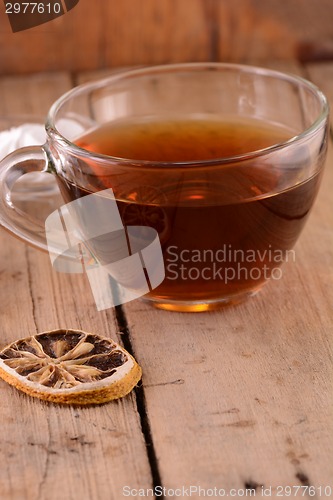 Image of A cup of tea on wooden background