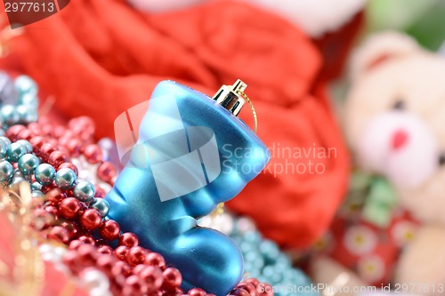 Image of blue christmas boot with gifts, new year holiday