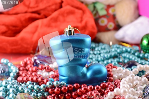 Image of blue christmas boot with gifts, new year holiday