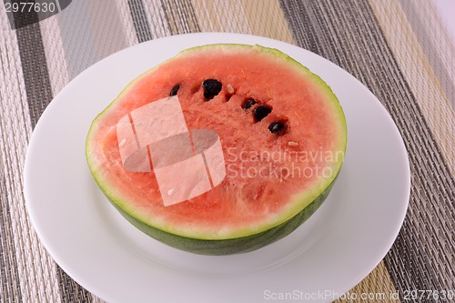 Image of Slices of fresh water melon on the white plate