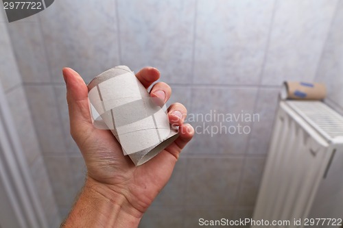 Image of Finding empty roll in the restroom