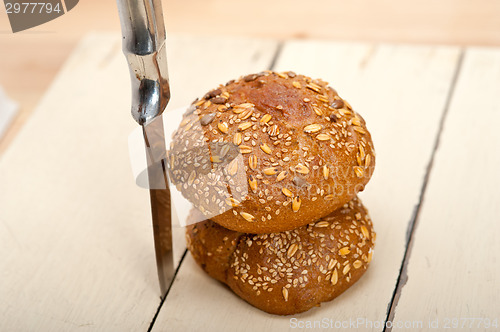 Image of organic bread over rustic table