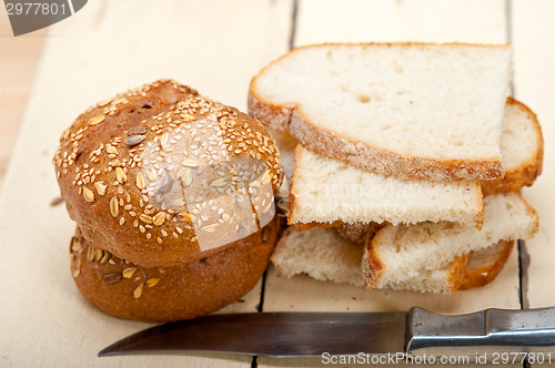 Image of organic bread over rustic table