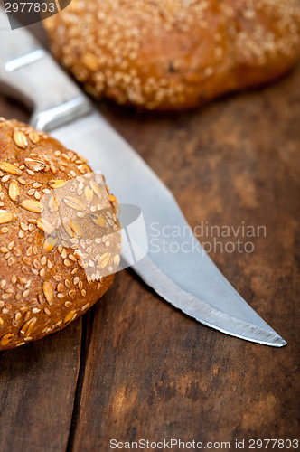 Image of organic bread over rustic table