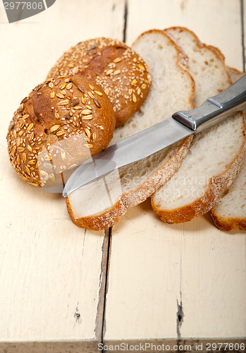 Image of organic bread over rustic table